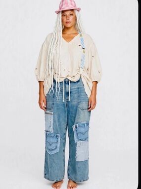 CRAM wide leg jeans with suspenders.